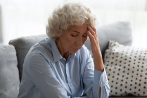 Senior experiencing symptoms of dizziness and nausea.